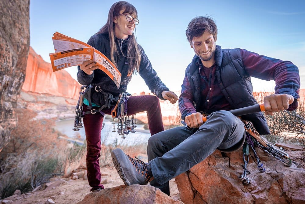 TigerTail_November_2019_7_Web-1 Couple laughing, the man is rolling his leg, while the woman holding Happy Muscles Book and showing where to roll
